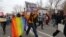 People march on the streets of Almaty to mark International Women's Day on March 8, 2021.