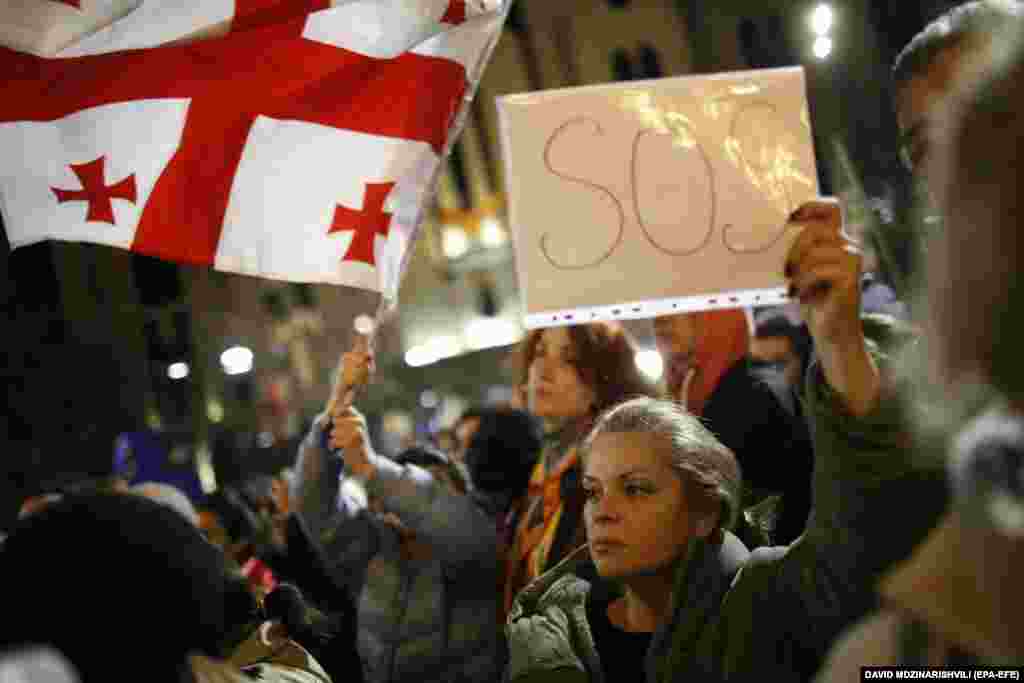 Supporters of opposition parties attend a protest in Tbilisi on October 28 opposing the results of the parliamentary elections held on October 26.&nbsp;Georgian prosecutors have summoned President Salome Zurabishvili to testify as they launched an investigation into&nbsp;possible fraud&nbsp;during the vote that the ruling Georgia Dream party won amid allegations of violations from both the opposition and Zurabishvili.