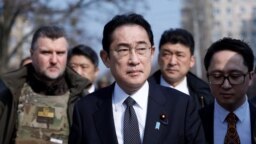Japanese Prime Minister Fumio Kishida visits the site of a mass grave in Bucha, outside of Kyiv, on March 21.