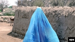 An Afghan woman in a burqa walks through the streets of Kabul in 2008.