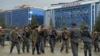 Afghan police keep watch at the site of a suicide attack outside a wedding hall in Kabul on November 16.