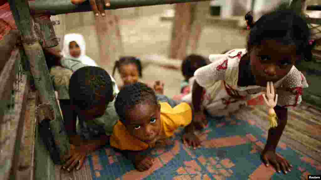 Children in Yemen climb into a mini-truck in a school, used as a temporary shelter for internally displaced people, in the southern port city of Aden. (Reuters/Khaled Abdullah)