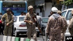 Members of the Iranian Revolutionary Guard secure the area outside the Iranian parliament during an attack on the complex in the capital Tehran, June 7, 2017