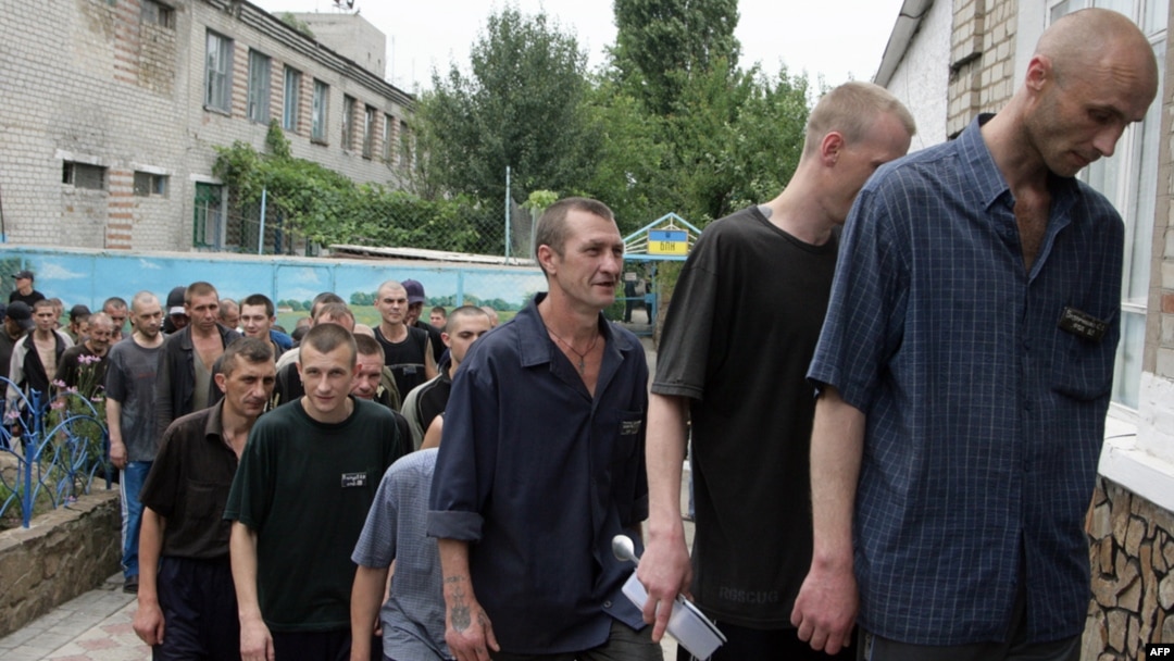 Tubercular patients at a penal colony in the Ukrainian village of Zhdanovka, in the Donetsk region, line up to enter the canteen.