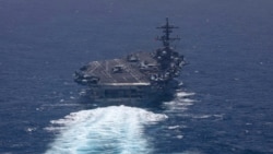 A US Navy handout photo released on May 7 shows the aircraft carrier USS George H.W. Bush sailing in the Arabian Sea. 