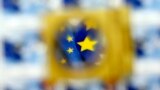 Serbia -- A part of the EU flag is pictured through a magnifying glass on a special edition of postage stamps, as Serbia begins talks in Brussels on joining the European Union, in Belgrade, January 21, 2014