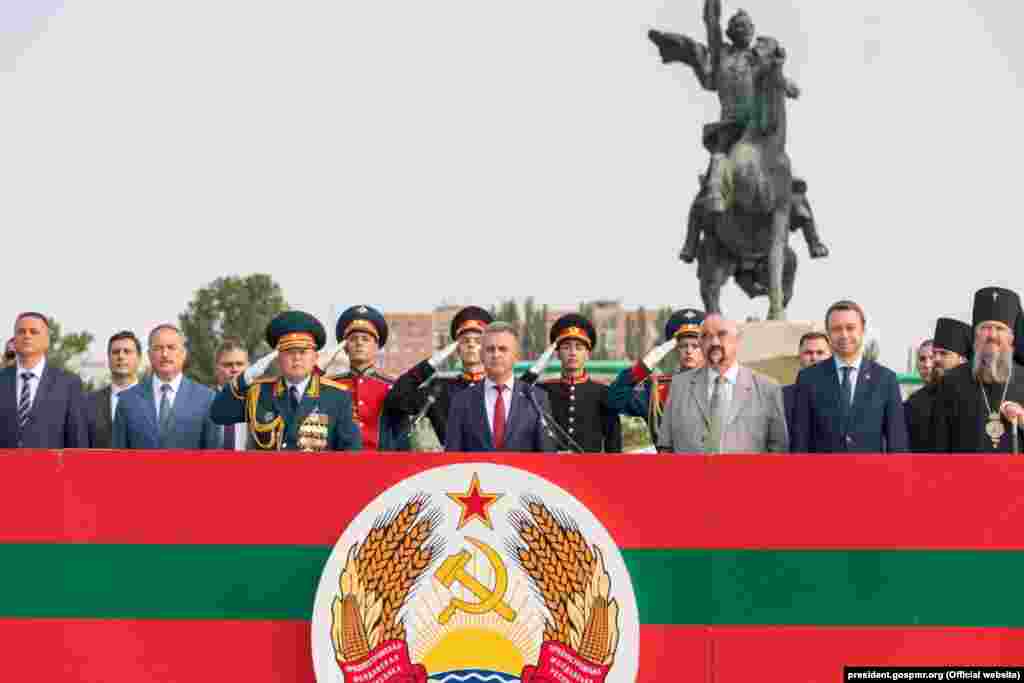 Separatist leader Vadim Krasnoselsky (center) and the first leader of the breakaway region, Igor Smirnov (third from right), attend a military parade on September 2, 2019. Smirnov lost an election in 2011 to Yevgeny Shevchuk, whom Krasnoselsky defeated in a 2016 vote.