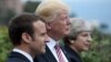 French President Emmanuel Macron, U.S. President Donald Trump, and British Prime Minister Theresa May (left to right) at the G7 summit in Sicily on May 26. 