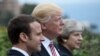 French President Emmanuel Macron (L), U.S. President Donald Trump (C) and British Prime Minister Theresa May (R) at G-7 summit last month.