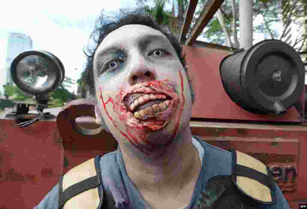 A member of the Indonesian Zombie Club takes part in a march in Jakarta. Hundreds of members of the club collected donations for Jakarta residents affected by recent floods. (AFP/Adak Berry)