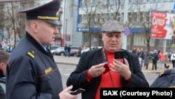 Belarusian journalist Syarhey Hardzievich (right) was also ordered to pay a $1,600 fine. (file photo)