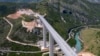 An aerial views shows a part of the new highway connecting the city of Bar on Montenegro's Adriatic coast to landlocked neighbor Serbia near Matesevo in May 2021.