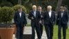 Head of Iranian Atomic Energy Organization, Ali Akbar Salehi, 2nd left, and Iranian Foreign Minister Javad Zarif, 2nd right, walk together during negotiations at an hotel in Lausanne, Switzerland, Sunday March 29, 2015.