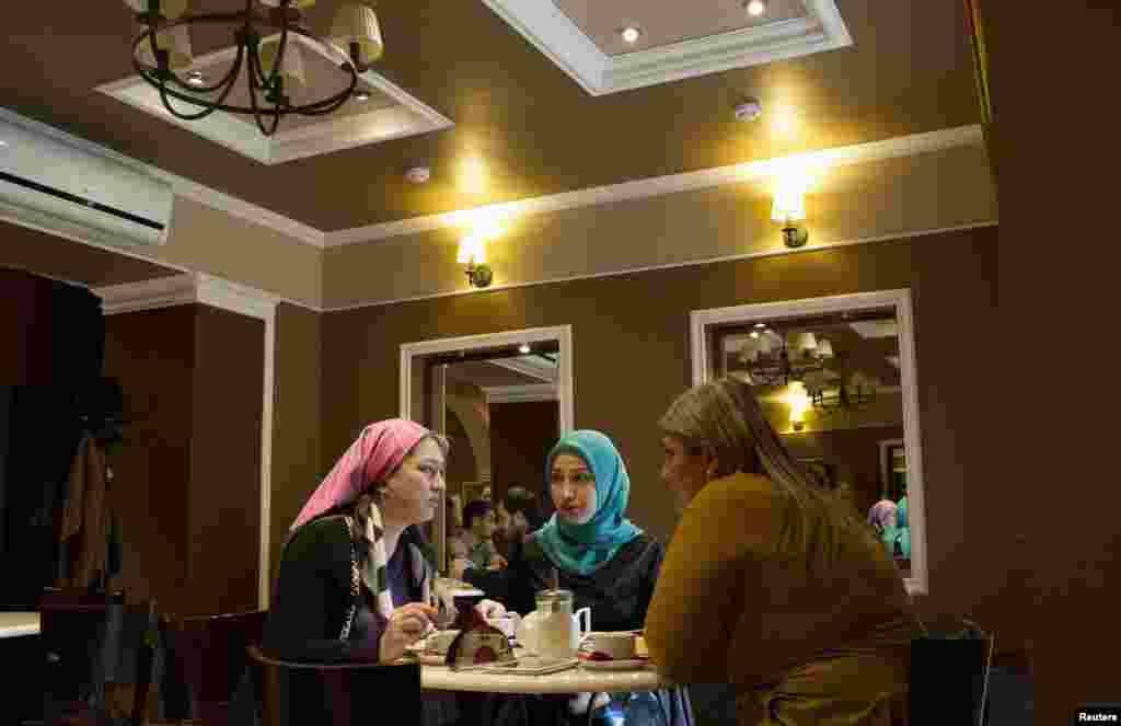 Women chat at a cafe in Grozny.