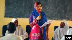 Pakistani activist for female education and the youngest-ever Nobel Prize laureate Malala Yousafzai addresses young refugees at Kenya's sprawling Dadaab refugee complex during a visit organised by the UN High Commissioner for Refugees.