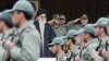 Iranian President Mahmud Ahmadinejad speaks before massive portraits of Ayatollah Ruhollah Khomeini (left) and Ayatollah Ali Khamenei in Tehran in 2008.