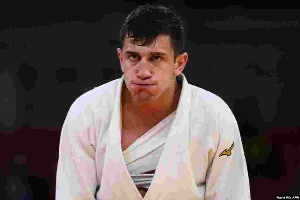 Грузин Лаша Бекаури после победы в четвертьфинале над узбекистанцем Давлатом Бобоновым в поединке дзюдо среди мужчин в категории до 90 кг во время Олимпийских игр, 28 июля 2021 года