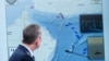 US -- General Dan Caine speaks as a map of the Strait of Hormuz is displayed