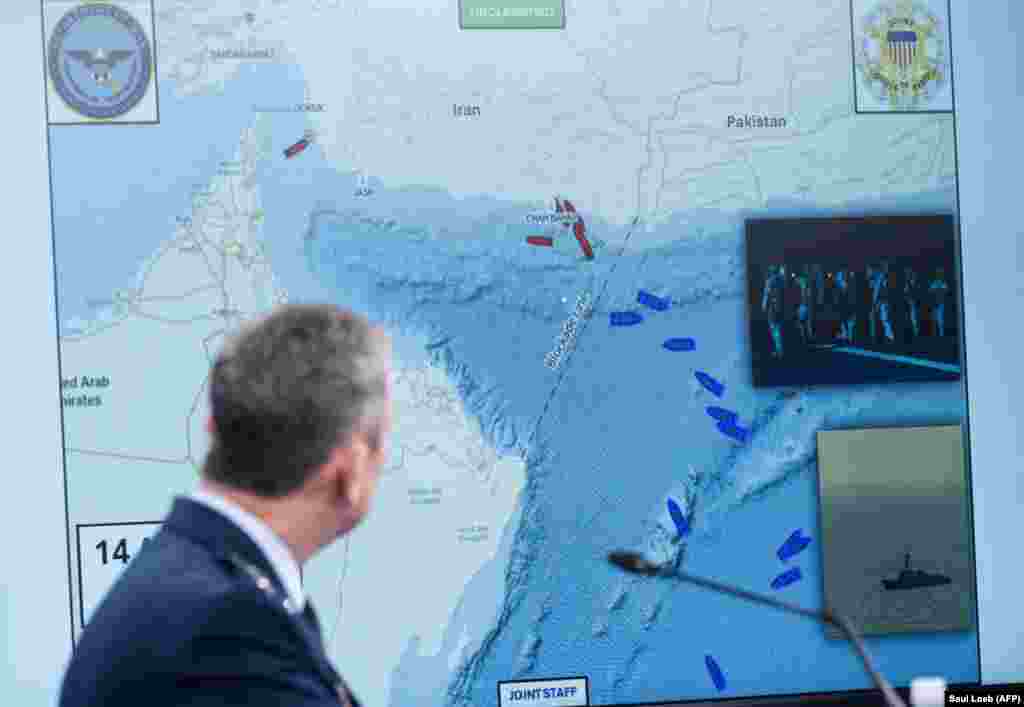 General Dan Caine, the chairman of the US Joint Chiefs of Staff, displays a map of the Strait of Hormuz during a press briefing at the Pentagon on April 16. The US announced it would prevent all shipping from entering or exiting Iranian ports for "as long as it takes."