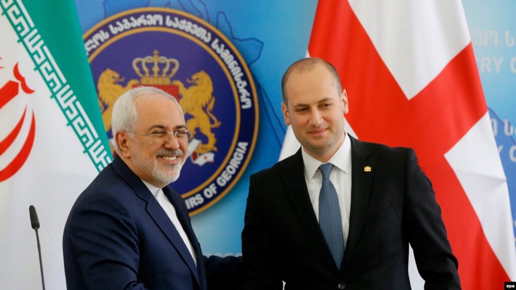 Georgian Foreign Minister Mikheil Janelidze (right) welcomes his Iranian counterpart Mohammad Javad Zarif in Tbilisi.