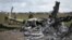 UKRAINE – Ukrainian sappers search for unexploded explosives through the gutted remains of a Russian helicopter destroyed. Hostomel, on the outskirts of Kyiv, April 18, 2022