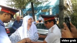 WATCH: Mother Of Tajik Attack Suspect Pours Gasoline On Herself In Protest