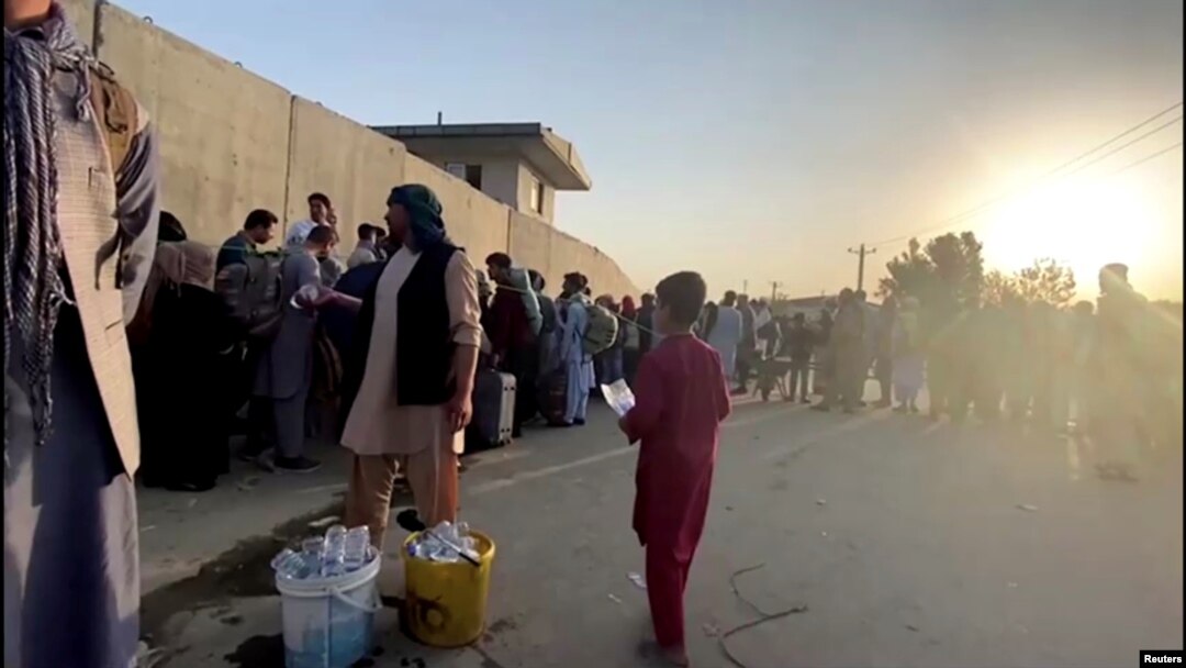 People waiting outside Kabul airport on August 22.