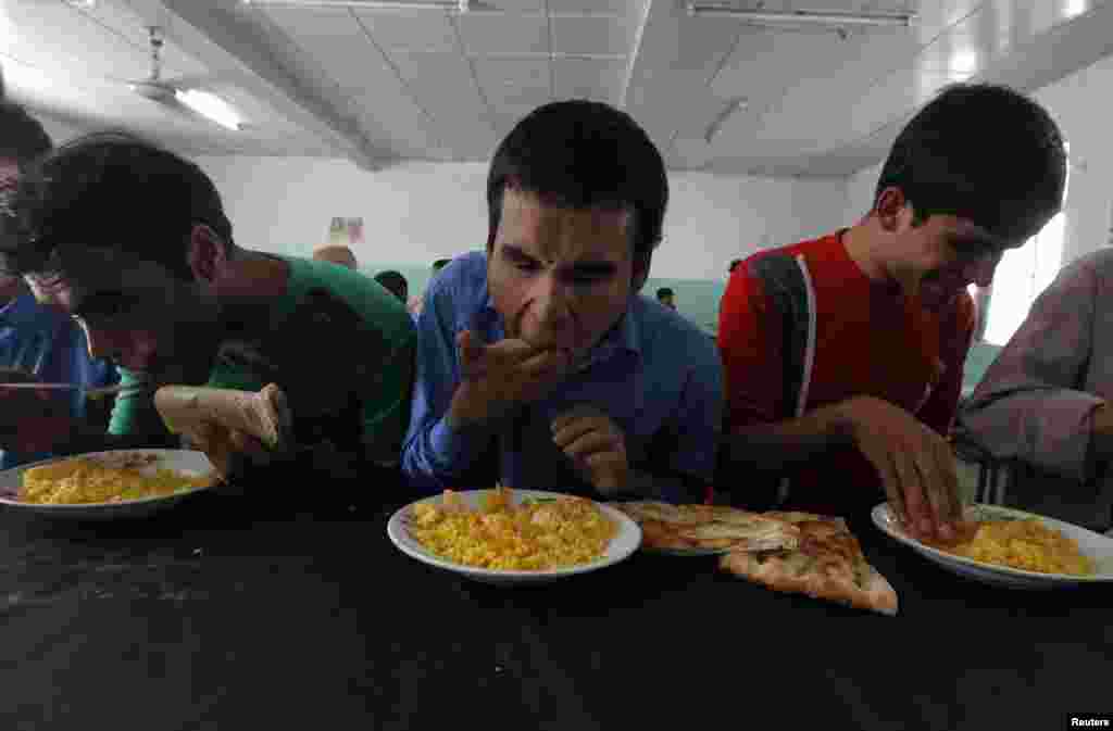 Blind students eat their meals at the Kabul Blind School.