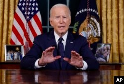 U.S. President Joe Biden speaks from the Oval Office of the White House on October 19 about the wars in Israel and Ukraine. The world “cannot and will not let terrorists like Hamas and tyrants like Putin win,” he says.