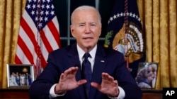 U.S. President Joe Biden speaks from the Oval Office of the White House on October 19 about the wars in Ukraine and Israel.