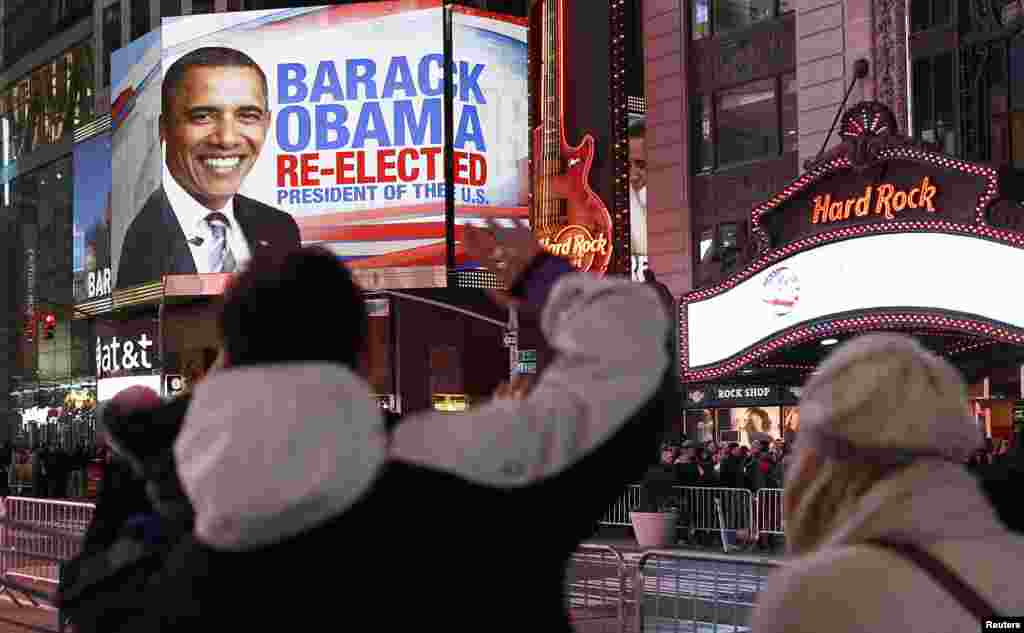 People celebrate in Times Square as the results are announced.