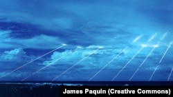 Reentry vehicles from a Peacekeeper missile system streak toward dummy targets off of the Marshall Islands. 