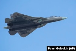 A Russian Air Force Sukhoi Su-57 fifth-generation fighter jet flies over Red Square during a rehearsal for the Victory Day military parade in Moscow in May 2021.