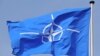 NATO flag flying at NATO Headquarters Brussels.