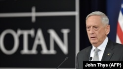 U.S. Defense Minister James Mattis gestures as he delivers a press conference during the second day of a defense ministers meeting at NATO headquarters in Brussels on November 9