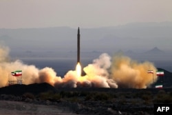 A 2010 photograph shows the test-firing in Iran of a surface-to-surface Qiam missile.