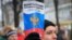 An opposition supporter holds a copy of the Russian Constitution during a rally against the reforms in Moscow on January 19.