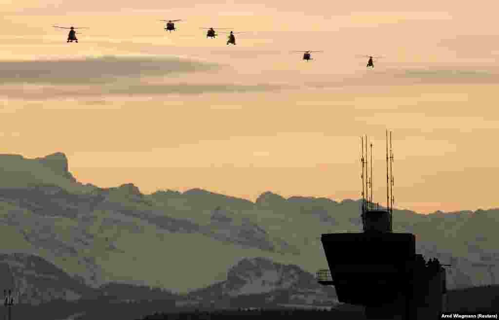 Helicopters approach before the arrival of U.S. President Donald Trump at Zurich airport on January 25. Trump was on his way to attend the Davos World Economic Forum. (Reuters/Arnd Wiegmann)