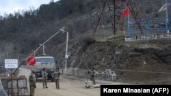 NAGORNO-KARABAKH -- Azerbaijani and Turkish flags fly at an Azerbaijani checkpoint outside the town of Shushi (Susa), November 26, 2020