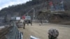 NAGORNO-KARABAKH -- Azerbaijani soldiers patrol at a checkpoint on a road outside the town of Shushi (Susa), November 26, 2020