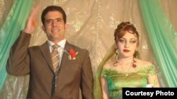 RFE/RL broadcaster Mustafa Sarwar is pictured with his wife, Behar, at their own wedding in Kabul on November 20, 2006.