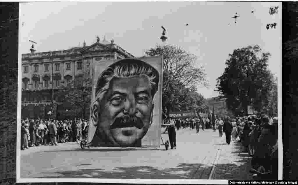 Soviet leader Josef Stalin&#39;s portrait being wheeled through central Vienna in 1952. From the end of World War II up until mid-1955, Vienna was divided into zones of occupation by the victorious Allies.