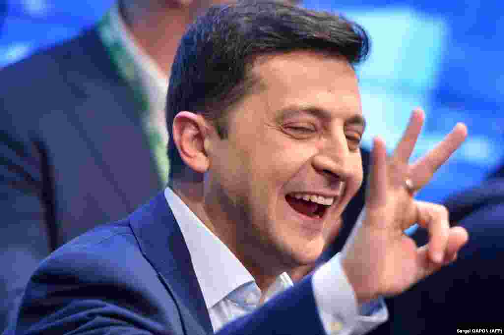 UKRAINE -- Ukrainian comedian and presidential candidate Volodymyr Zelensky reacts after the announcement of the first exit poll results in the second round of Ukraine's presidential election at his campaign headquarters in Kyiv on April 21, 2019. 