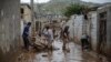 IRAN -- Men clear away mud following floods in the Iranian city of Mamulan in Lorestan province, April 7, 2019