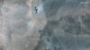 A closer satellite view shows holes and craters on a ridge at Fordow underground complex, after the U.S. struck the underground nuclear facility, near Qom