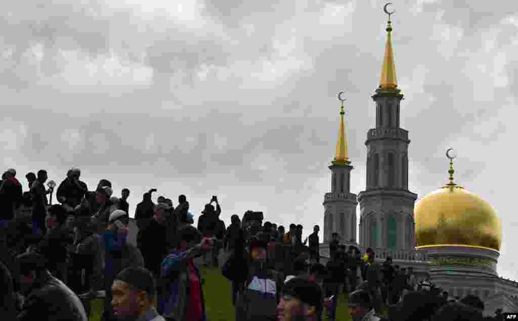 Muslims gather to offer prayers during celebrations of Eid al-Fitr, marking the end of the fasting month of Ramadan, at the central mosque in Moscow on June 25. (AFP/Vasily Maksimov)