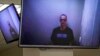 “Your emperor has no clothes,” Aleksei Navalny told a judge by video link from prison, looking rail-gaunt in his first appearance on camera since he ended a hunger strike that doctors said would have killed him very soon.