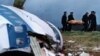 На месте падения взорванного самолета в Локерби (22 декабря 1988 года) 
