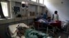 Afghan civilians injured in a suicide attack in the eastern Afghan city of Jalalabad are being treated in a local hospital in Jalalabad on September 11.