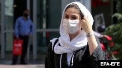 Face masks are now commonplace on the streets of Tehran as the Islamic republic continues to battle the MIddle East's deadliest outbreak of COVID-19.